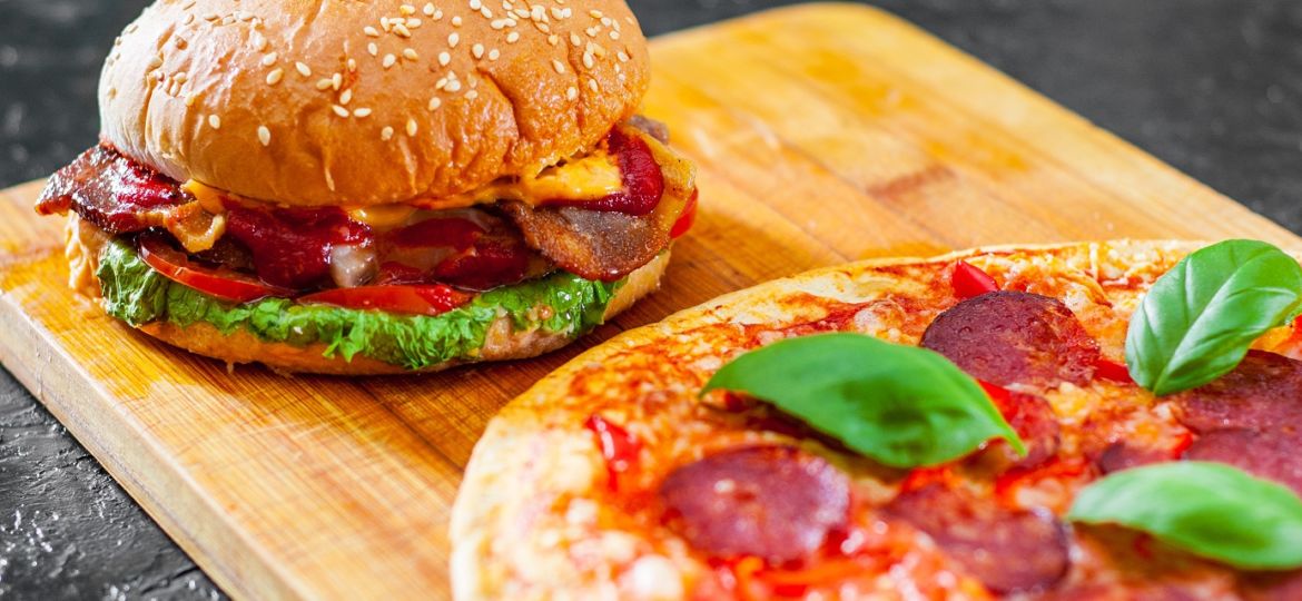 bacon cheese burger with beef patty tomato onion and Pizza with Mozzarella cheese, Ham, Tomatoes, salami, pepper, pepperoni Spices and Fresh Basil